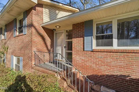 a view of a brick house with a large windows