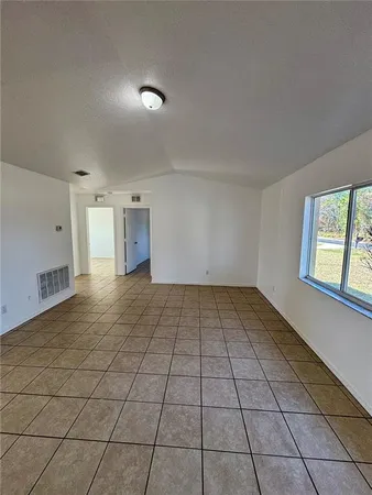 a view of a livingroom and window