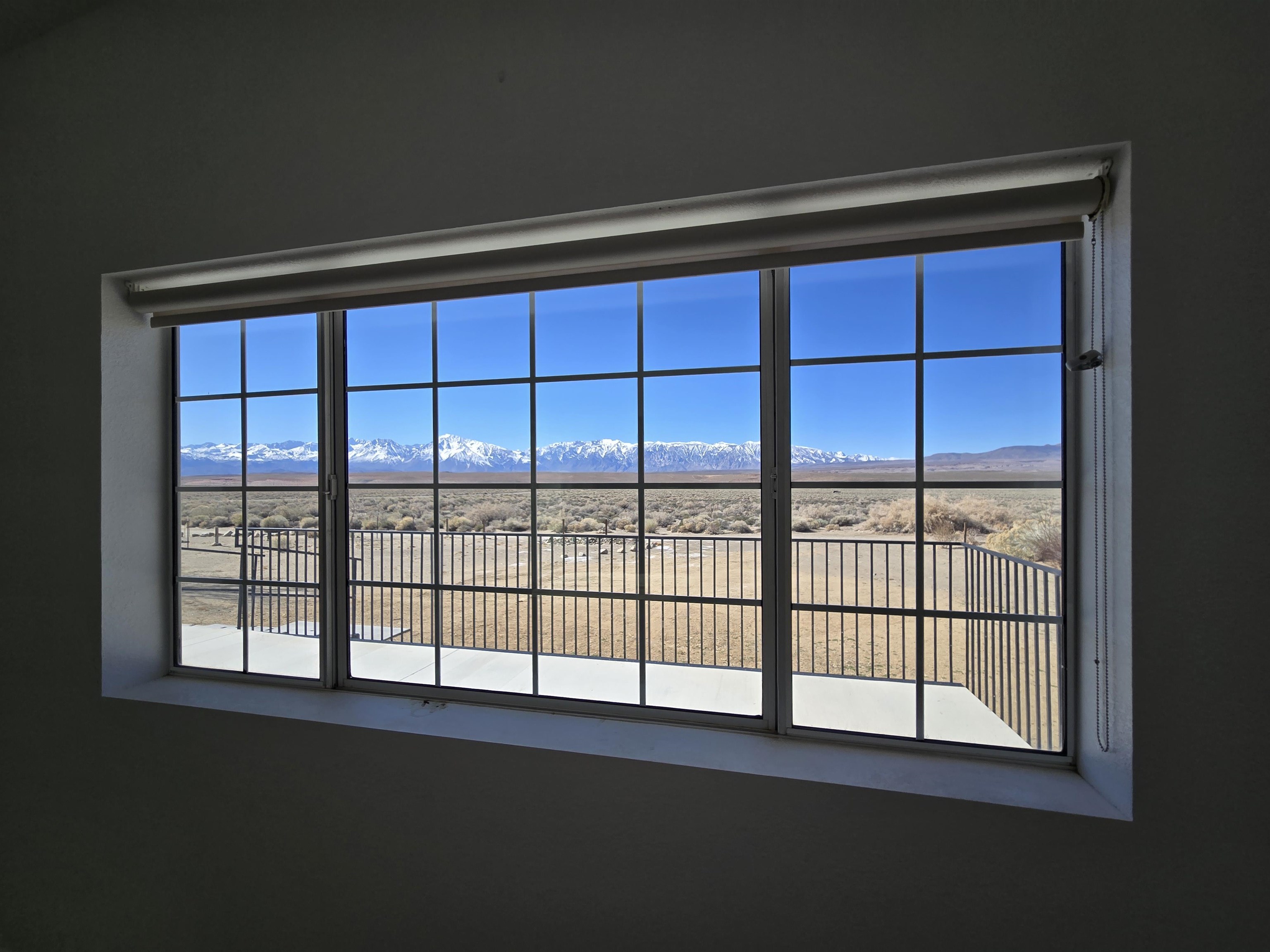 75 Sequoia Street Chalfant, CA 93514 - Photo 14 of 21 a view of empty room with windows