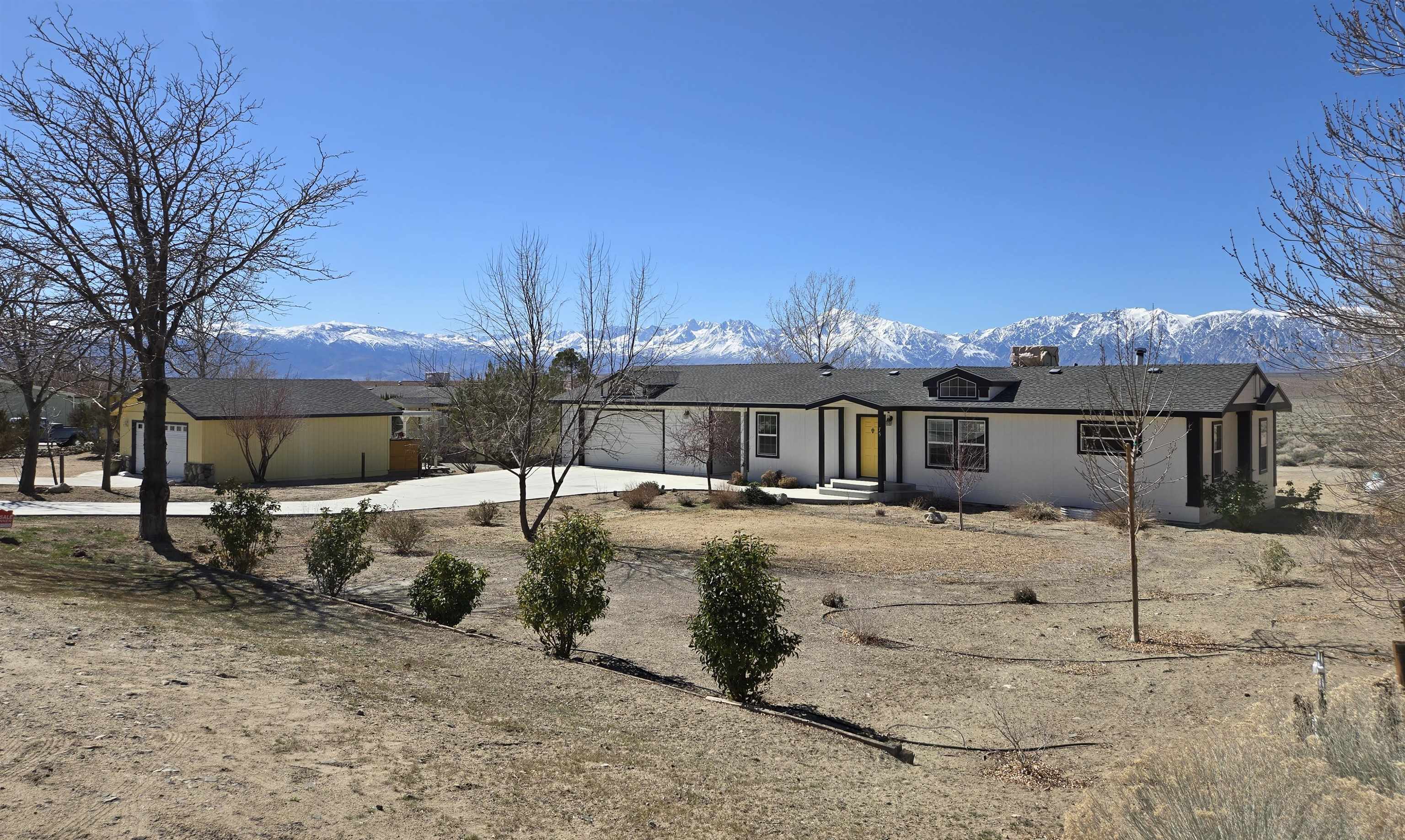 75 Sequoia Street Chalfant, CA 93514 - Photo 21 of 21 a view of a house with a yard covered in snow