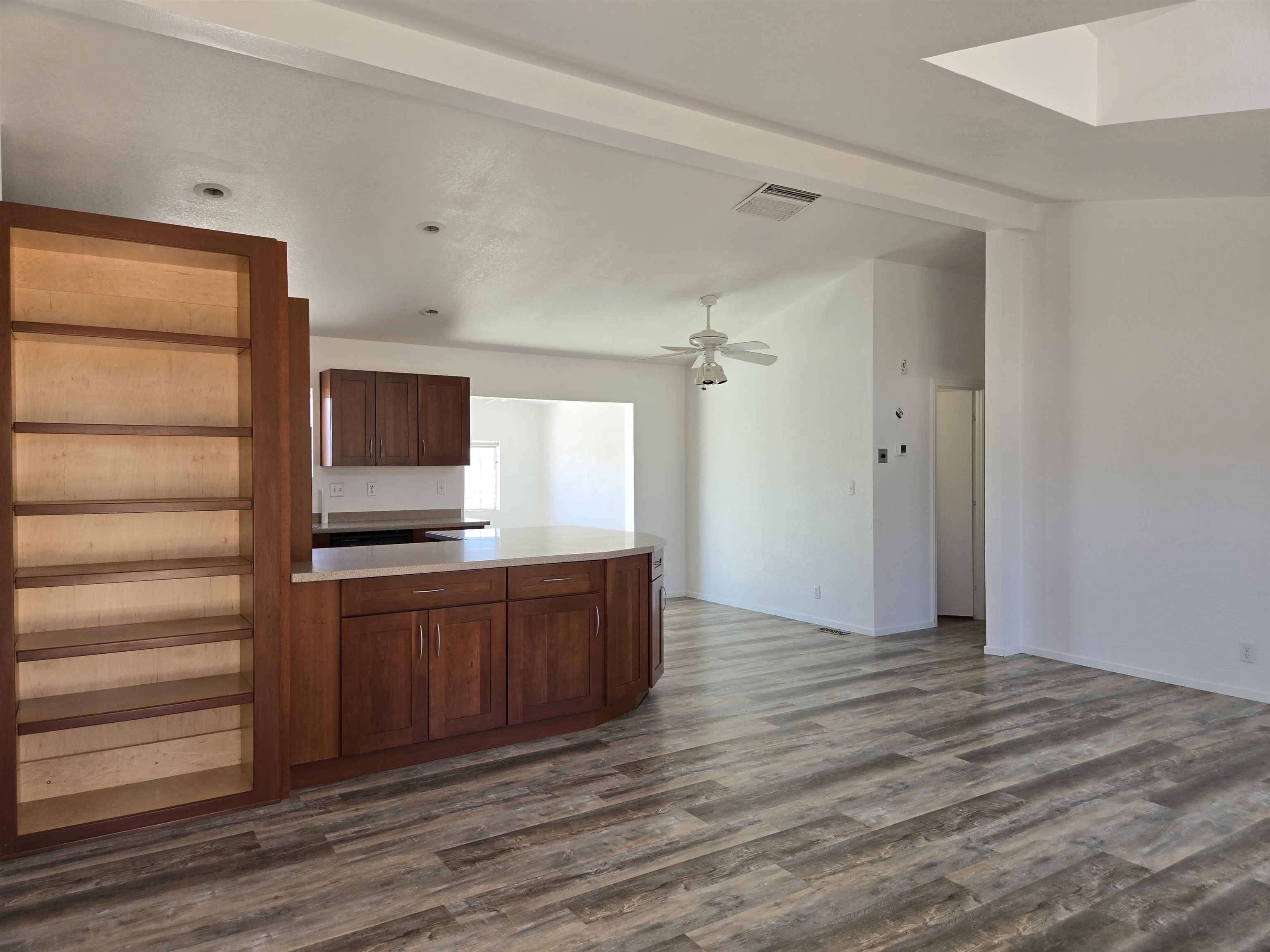 75 Sequoia Street Chalfant, CA 93514 - Photo 3 of 21 a hall with cabinets and wooden floor