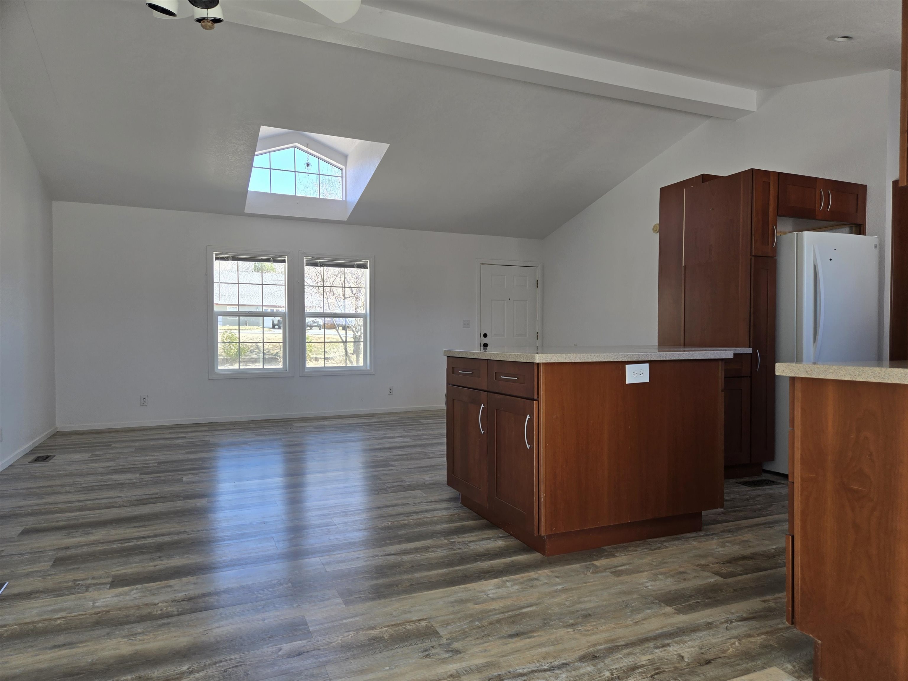 75 Sequoia Street Chalfant, CA 93514 - Photo 5 of 21 an empty room with wooden floor and windows