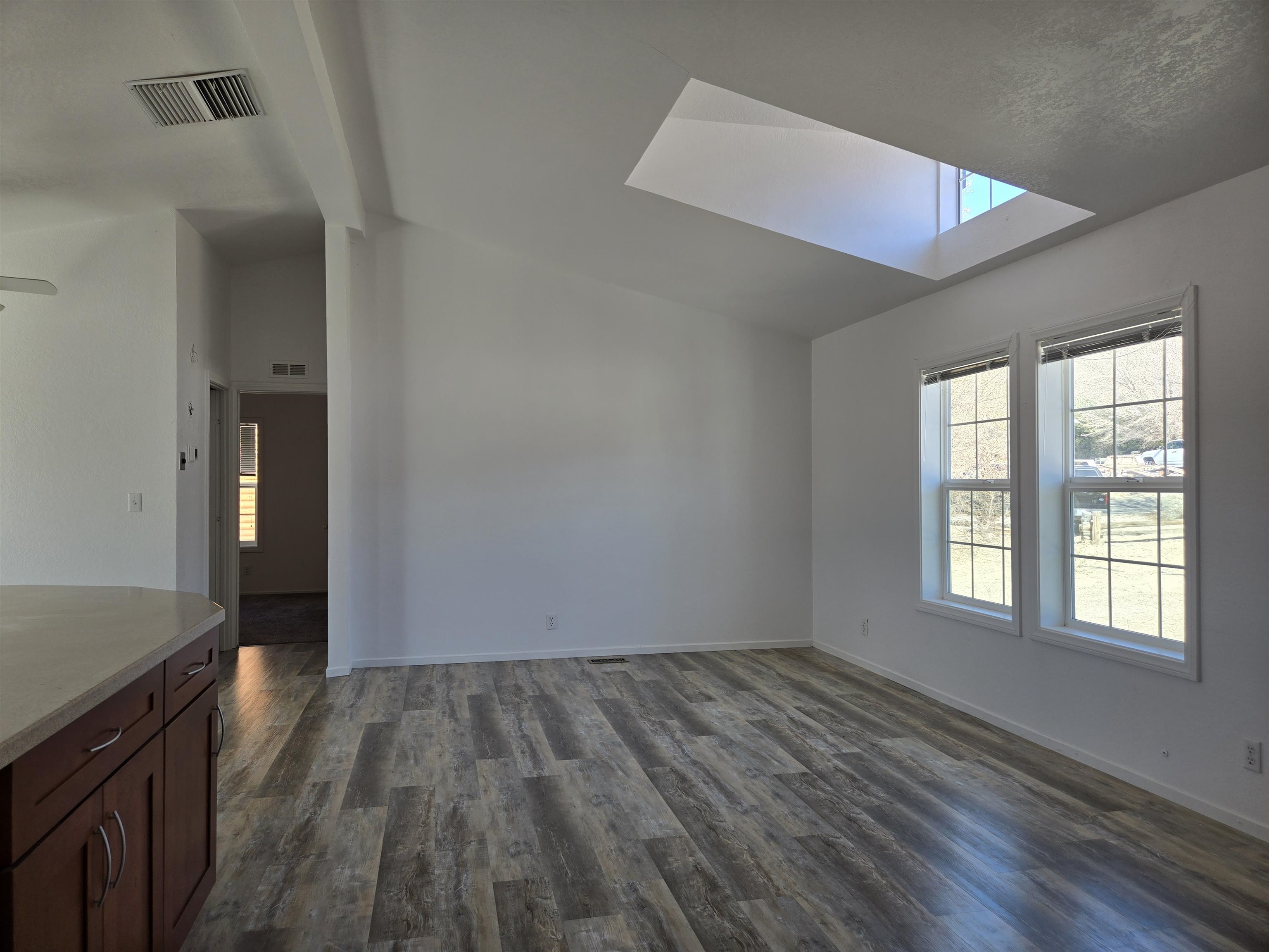 75 Sequoia Street Chalfant, CA 93514 - Photo 6 of 21 wooden floor in an empty room with a window