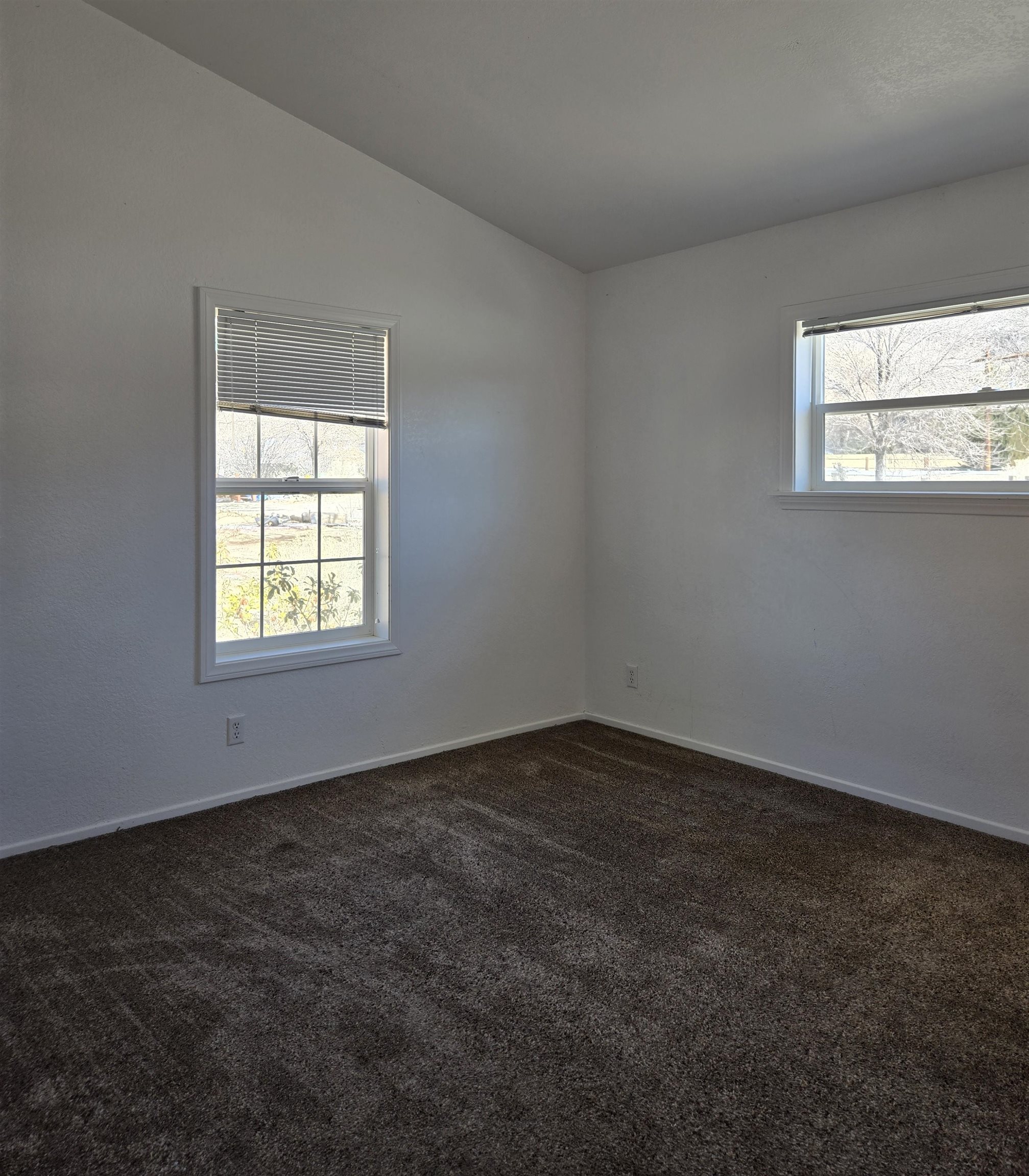 75 Sequoia Street Chalfant, CA 93514 - Photo 8 of 21 an empty room with a window