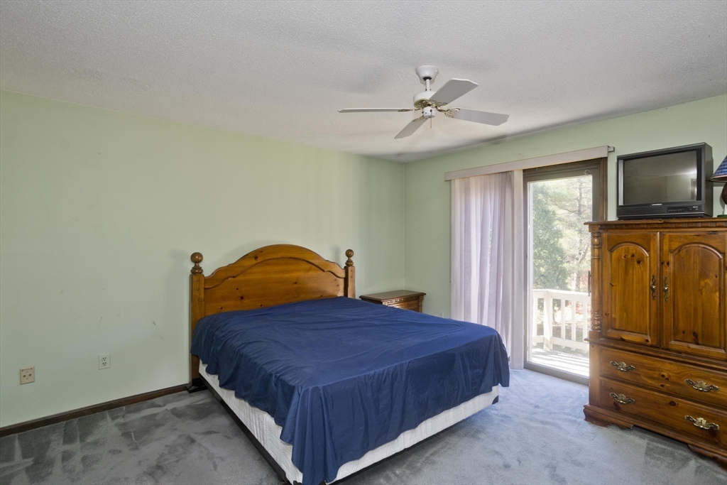 425 Miller Street Ludlow, MA 01056 - Photo 17 of 40 a bedroom with a bed and a flat screen tv