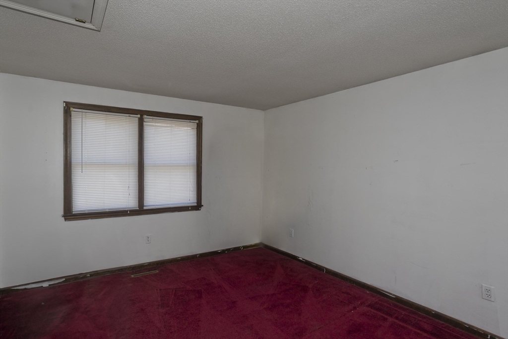 425 Miller Street Ludlow, MA 01056 - Photo 22 of 40 an empty room with a window