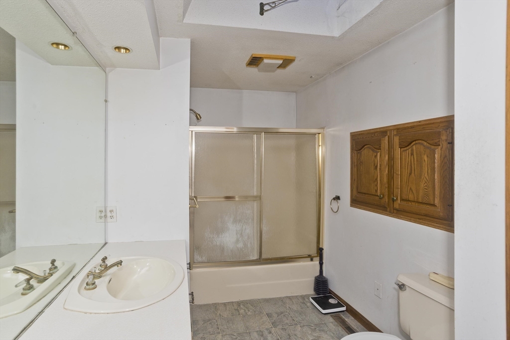 425 Miller Street Ludlow, MA 01056 - Photo 26 of 40 a bathroom with a sink and shower