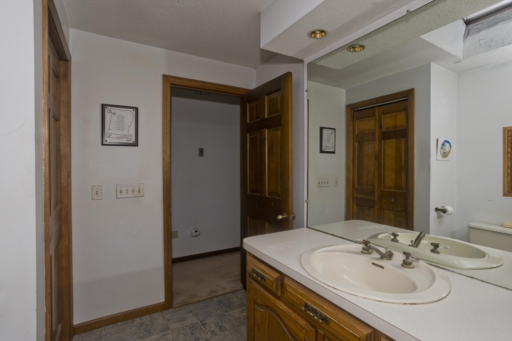 425 Miller Street Ludlow, MA 01056 - Photo 28 of 40 a bathroom with a sink and a mirror