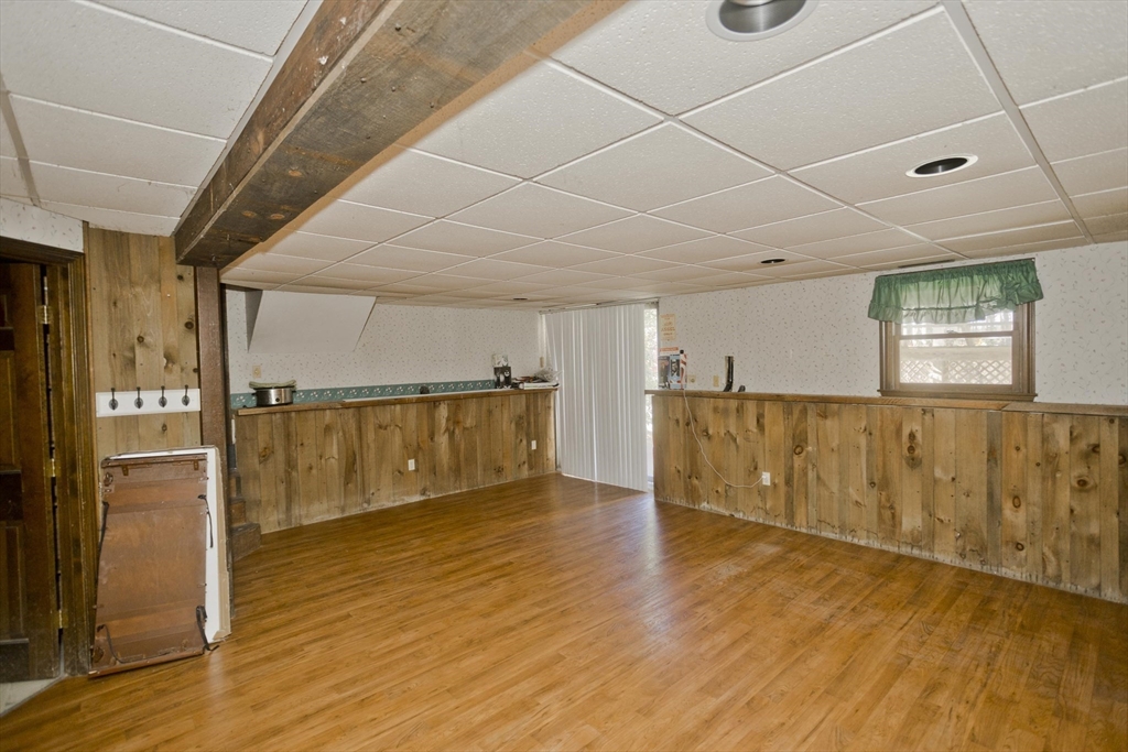 425 Miller Street Ludlow, MA 01056 - Photo 31 of 40 a view of an empty room with wooden floor and a window