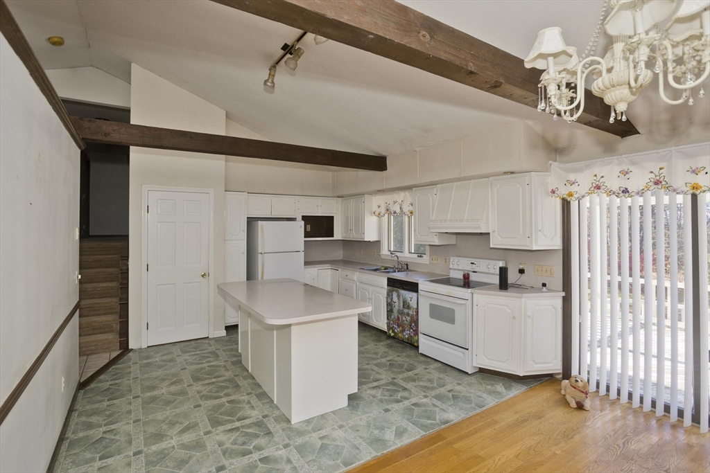 425 Miller Street Ludlow, MA 01056 - Photo 6 of 40 a kitchen with white cabinets and sink