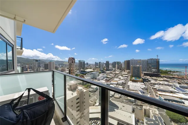 a view of a balcony with wooden floor and seating space