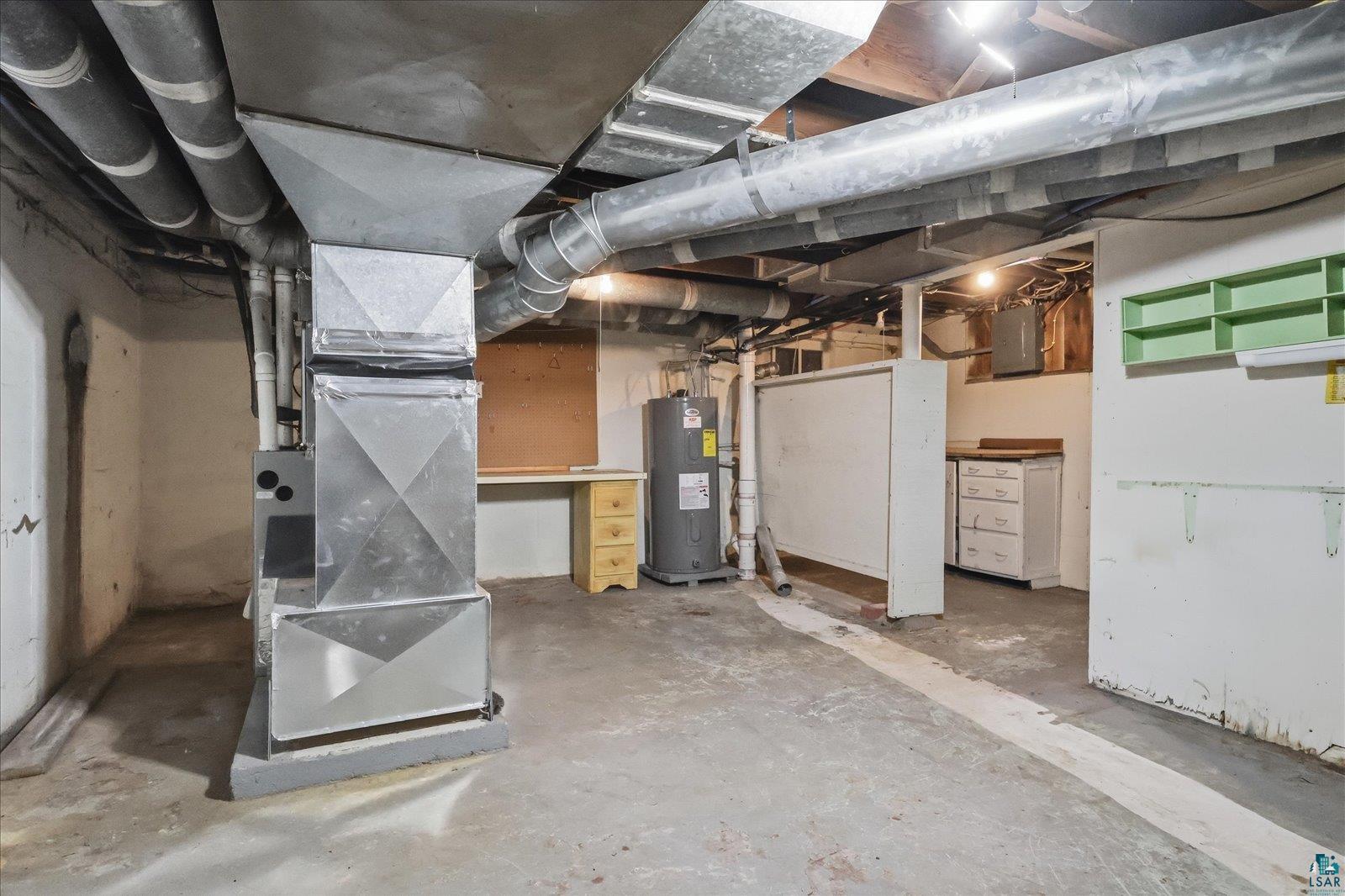 5192 Lavaque Junction Road Hermantown, MN 55811 - Photo 32 of 34 Basement utility space featuring a furnace, water heater, and exposed overhead ductwork