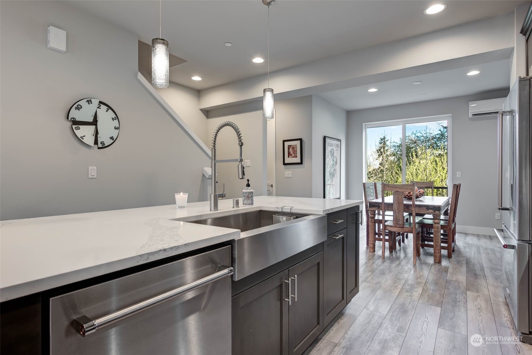 524 Pl Se 238th Bothell Wa 98021, Unit D Bothell, WA 98021 - Photo 13 of 37 a kitchen with a table chairs sink and cabinets