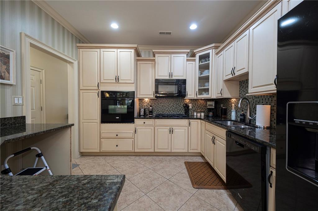 408 Independence Lane Freedom, PA 15042 - Photo 3 of 26 a kitchen with stainless steel appliances kitchen island granite countertop a refrigerator and a stove top oven