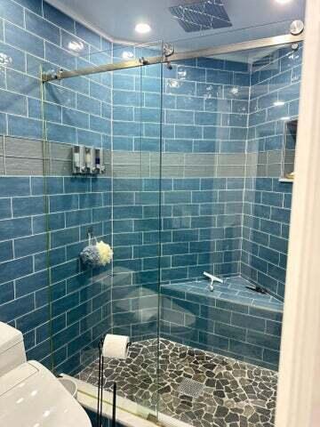 237 Seabreeze Circle Jupiter, FL 33477 - Photo 16 of 20 a bathroom with a shower