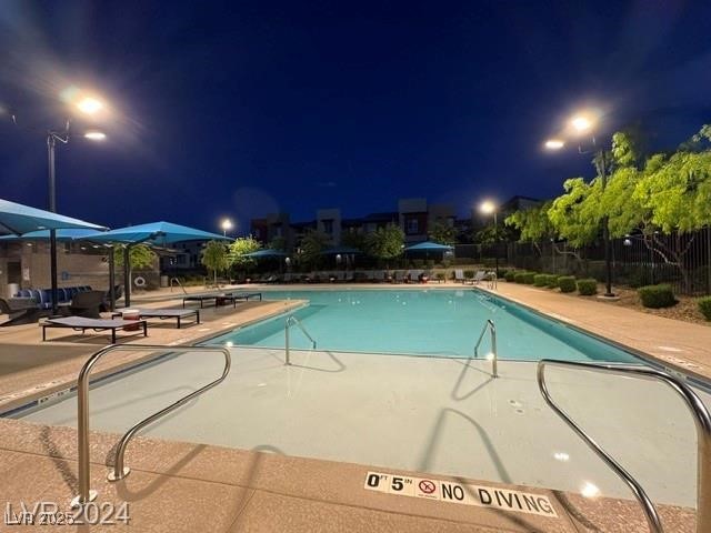 3197 Bertonico Street Henderson, NV 89044 - Photo 23 of 30 Pool at twilight with a patio and a community pool