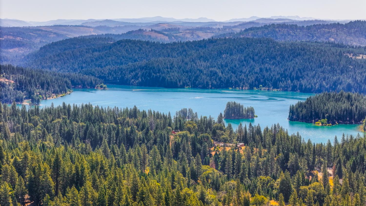 6193 Speckled Road Pollock Pines, CA 95726 - Photo 70 of 71 Home is less than a mile from Jenkinson Lake. This is a drone view of the lake from the property.
