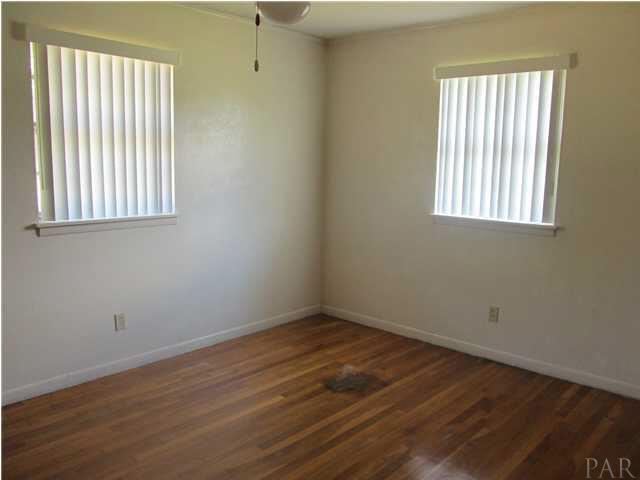 6084 St Alban Road Pensacola, FL 32503 - Photo 12 of 18 Master Bedroom, with hardwood flooring and two windows.