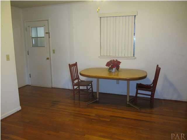 6084 St Alban Road Pensacola, FL 32503 - Photo 6 of 18 View of the dining area w/ window, and door to sunroom.