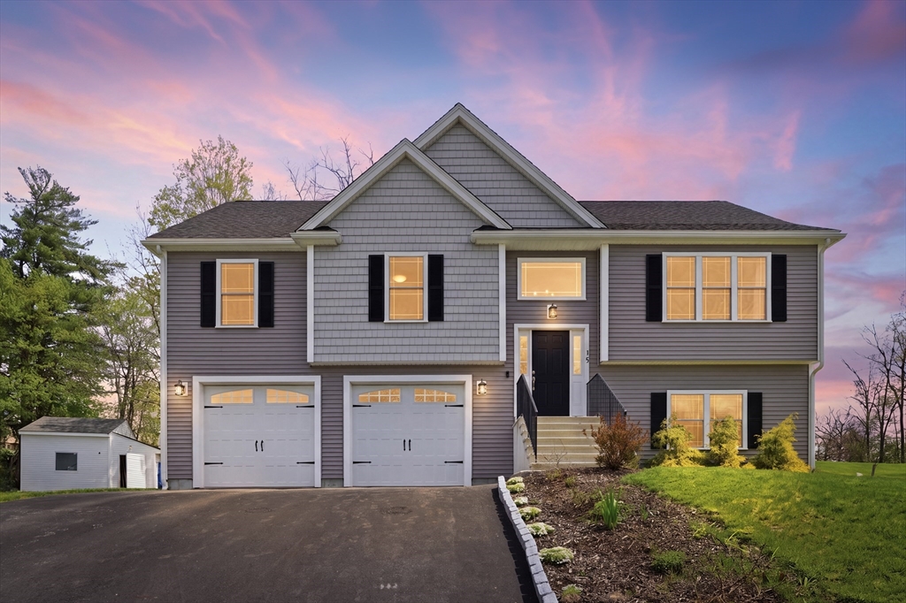 19 Progress Avenue Dudley, MA 01571 - Photo 1 of 42 a front view of a house with a yard