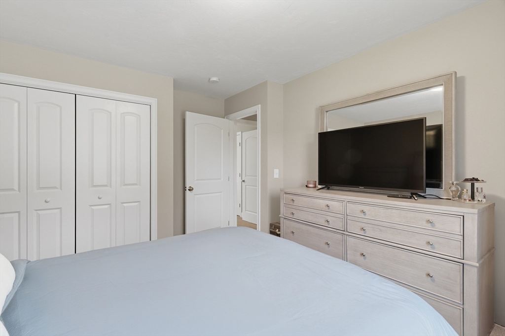 19 Progress Avenue Dudley, MA 01571 - Photo 17 of 42 a room with a flat screen tv and a television