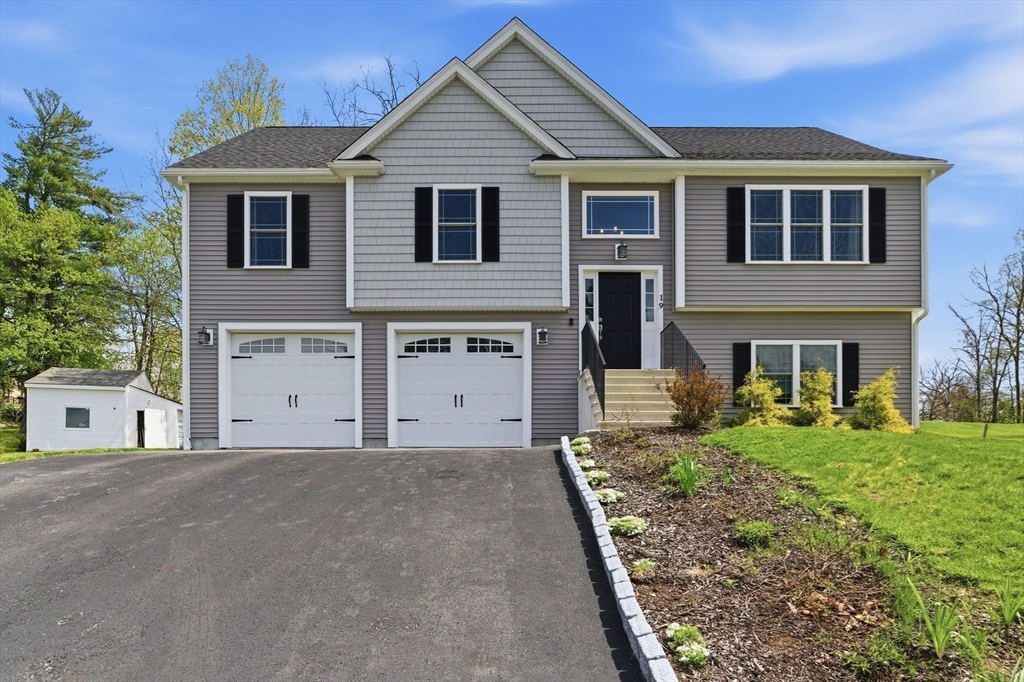 19 Progress Avenue Dudley, MA 01571 - Photo 36 of 42 a front view of a house with a yard