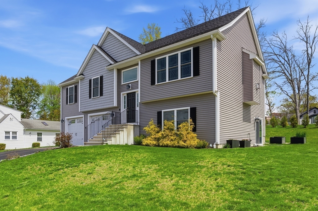 19 Progress Avenue Dudley, MA 01571 - Photo 39 of 42 a front view of a house with a yard