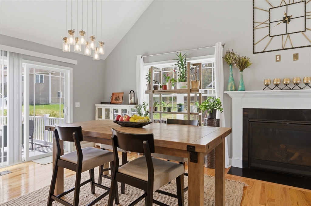 19 Progress Avenue Dudley, MA 01571 - Photo 6 of 42 a dining room with furniture a fireplace and a chandelier