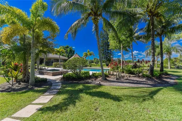 a view of a porch with a table and chairs