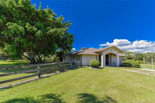 a living room with furniture fireplace and a window