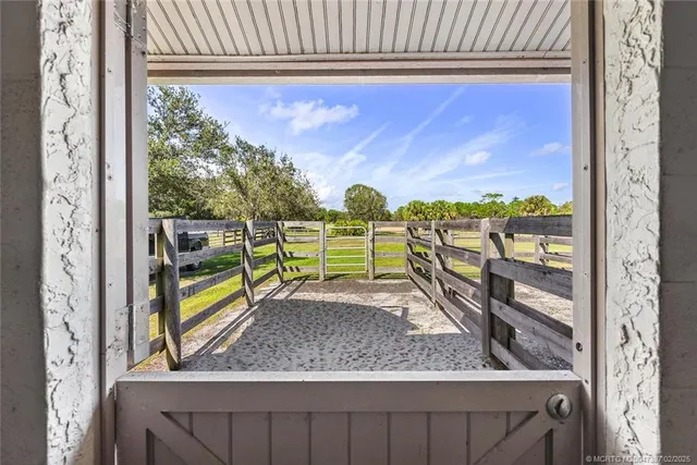 a spacious bathroom with a granite countertop sink a toilet a mirror and bathtub
