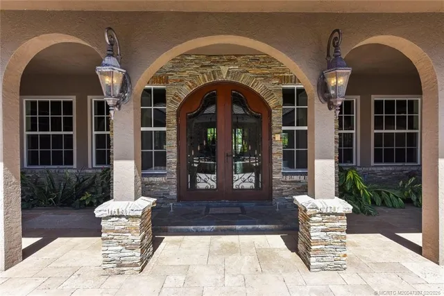 a living room with furniture a flat screen tv and wooden floor