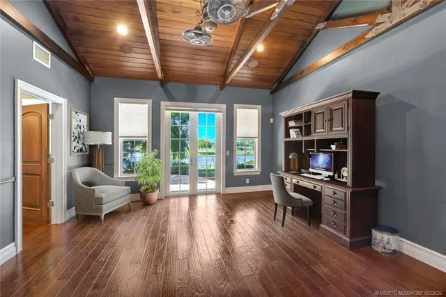 an aerial view of a swimming pool with outdoor seating