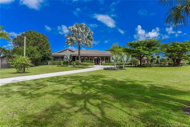 a view of backyard with patio