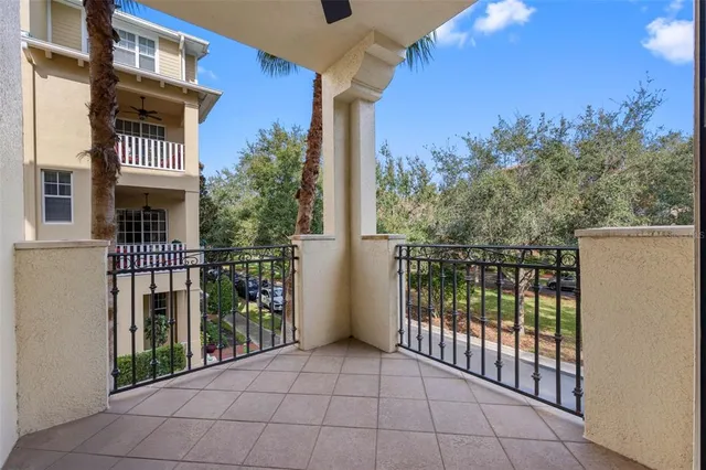 an empty room with fan and windows