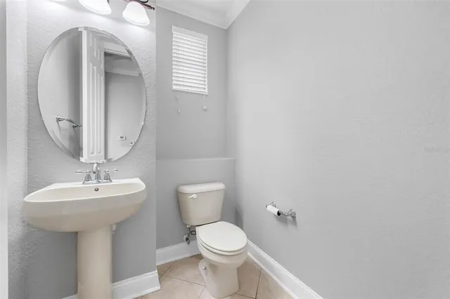 a large kitchen with kitchen island granite countertop lots of counter space and stainless steel appliances