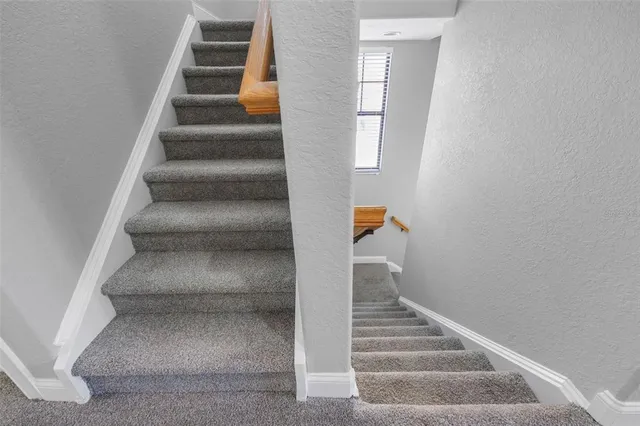 a view of a hallway with washer and dryer