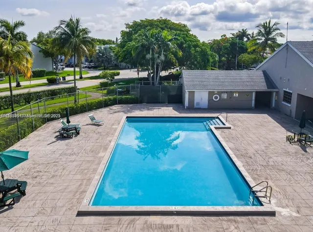 a view of a swimming pool with a garden