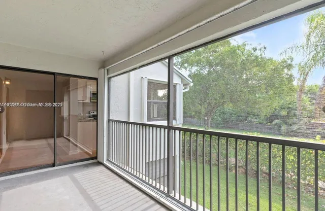 a view of a glass door with a balcony