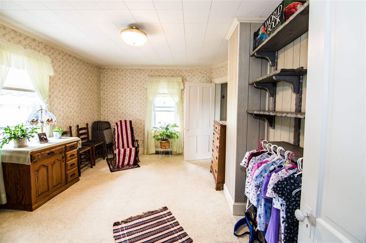 5565 Briery Branch Road Dayton, VA 22821 - Photo 13 of 26 a view of walk in closet with clothes and shoes