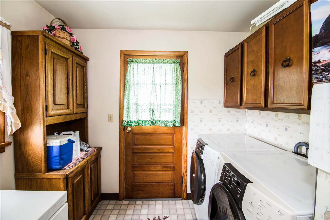 5565 Briery Branch Road Dayton, VA 22821 - Photo 14 of 26 a bathroom with a sink a washer and dryer