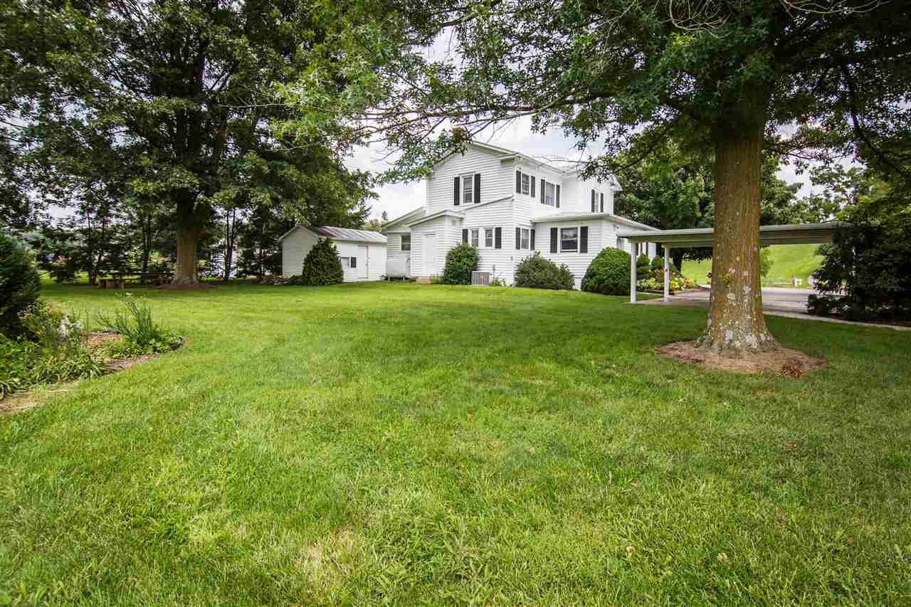 5565 Briery Branch Road Dayton, VA 22821 - Photo 4 of 26 a white house that has a big yard with large trees