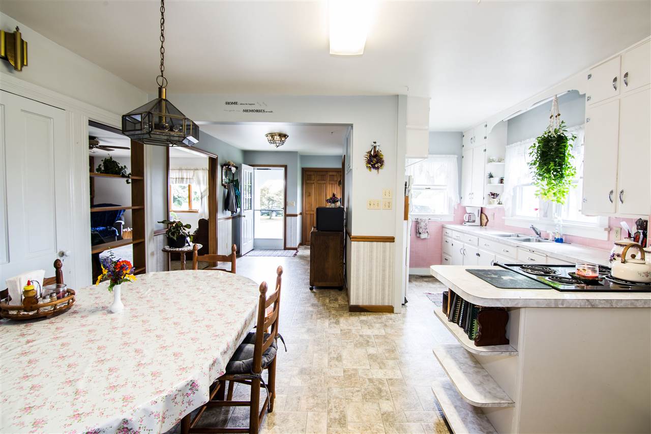 5565 Briery Branch Road Dayton, VA 22821 - Photo 5 of 26 a kitchen with a table and chairs in it
