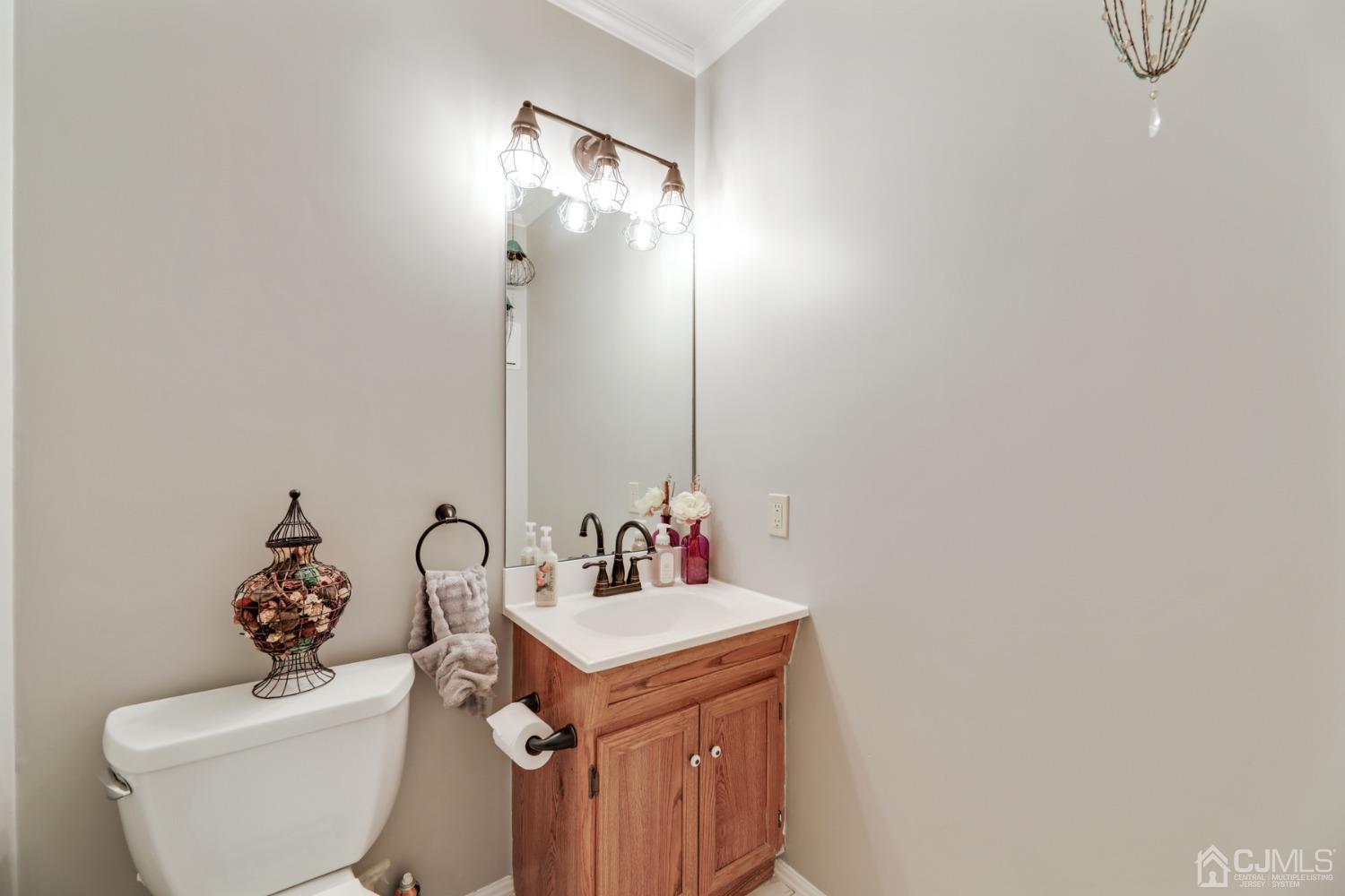 81 Pheasant Run Edison, NJ 08820 - Photo 11 of 24 a bathroom with a sink and a toilet
