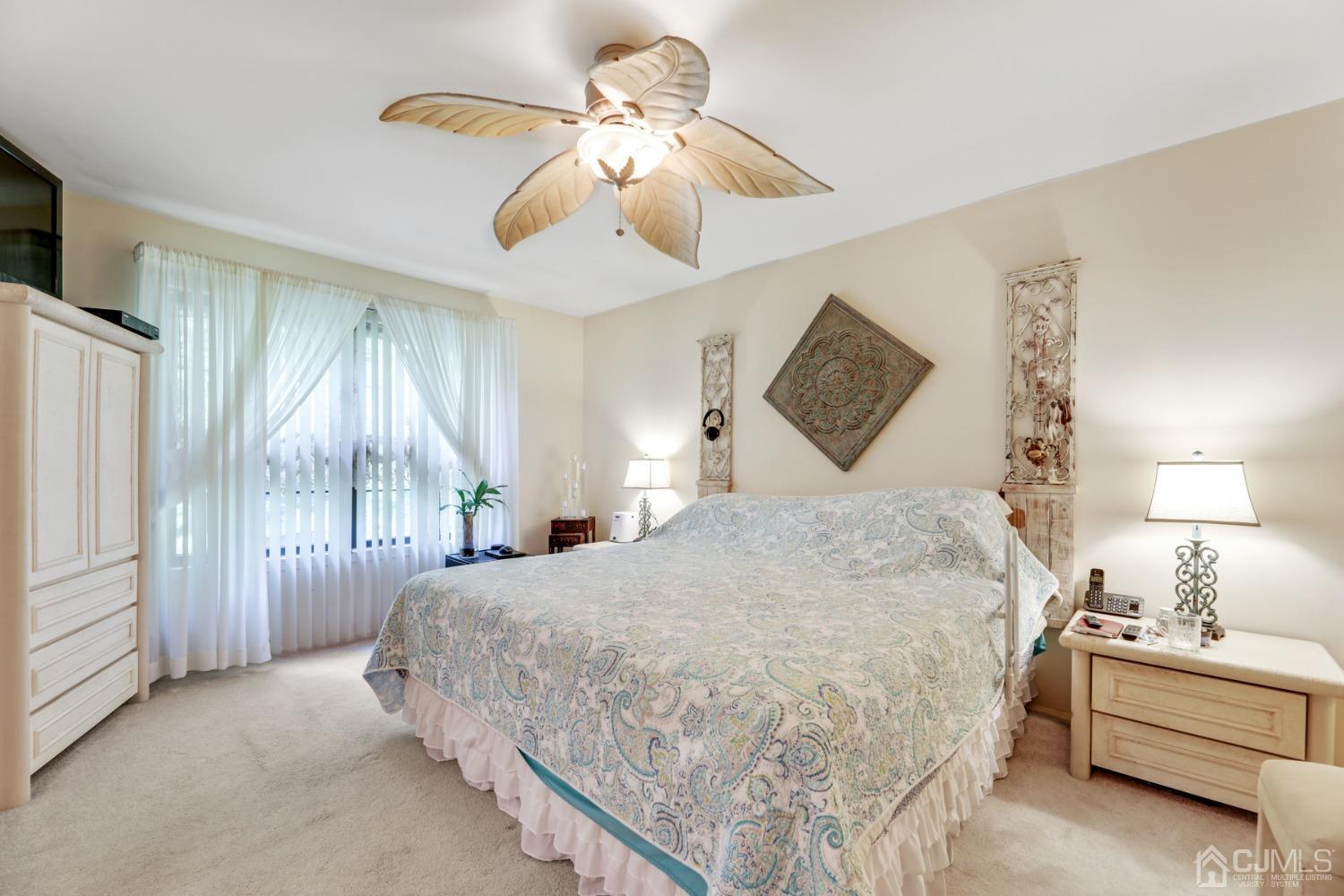 81 Pheasant Run Edison, NJ 08820 - Photo 12 of 24 a bedroom with a bed painting on the wall and window