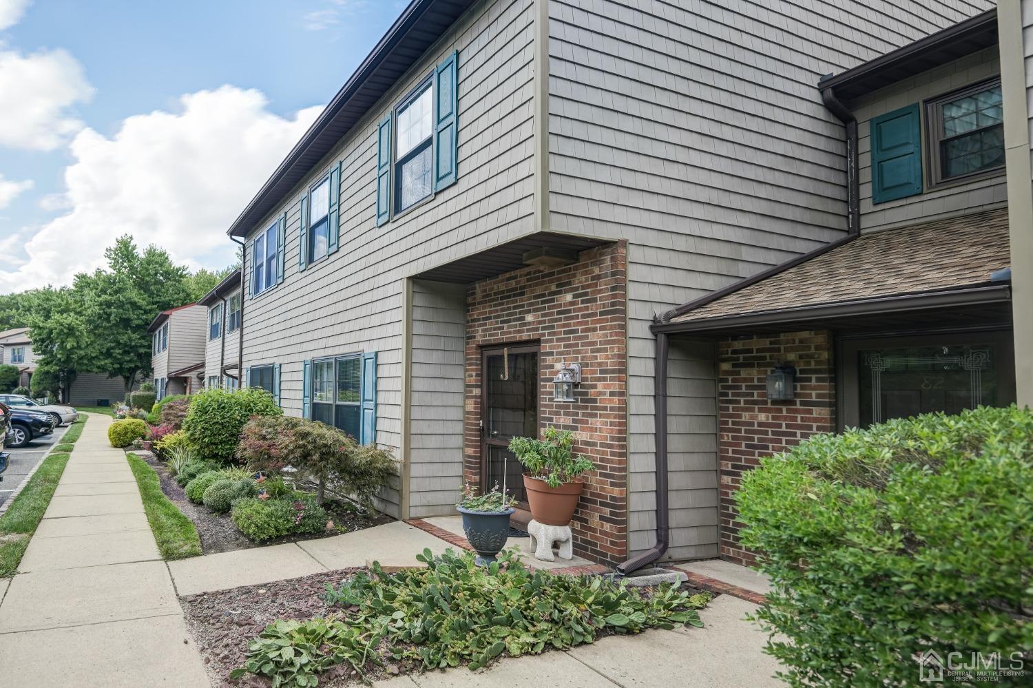 81 Pheasant Run Edison, NJ 08820 - Photo 2 of 24 a front view of a house with garden