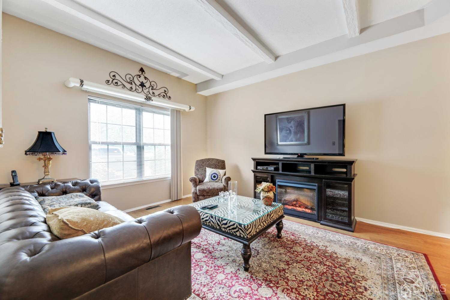 81 Pheasant Run Edison, NJ 08820 - Photo 4 of 24 a living room with furniture and a window