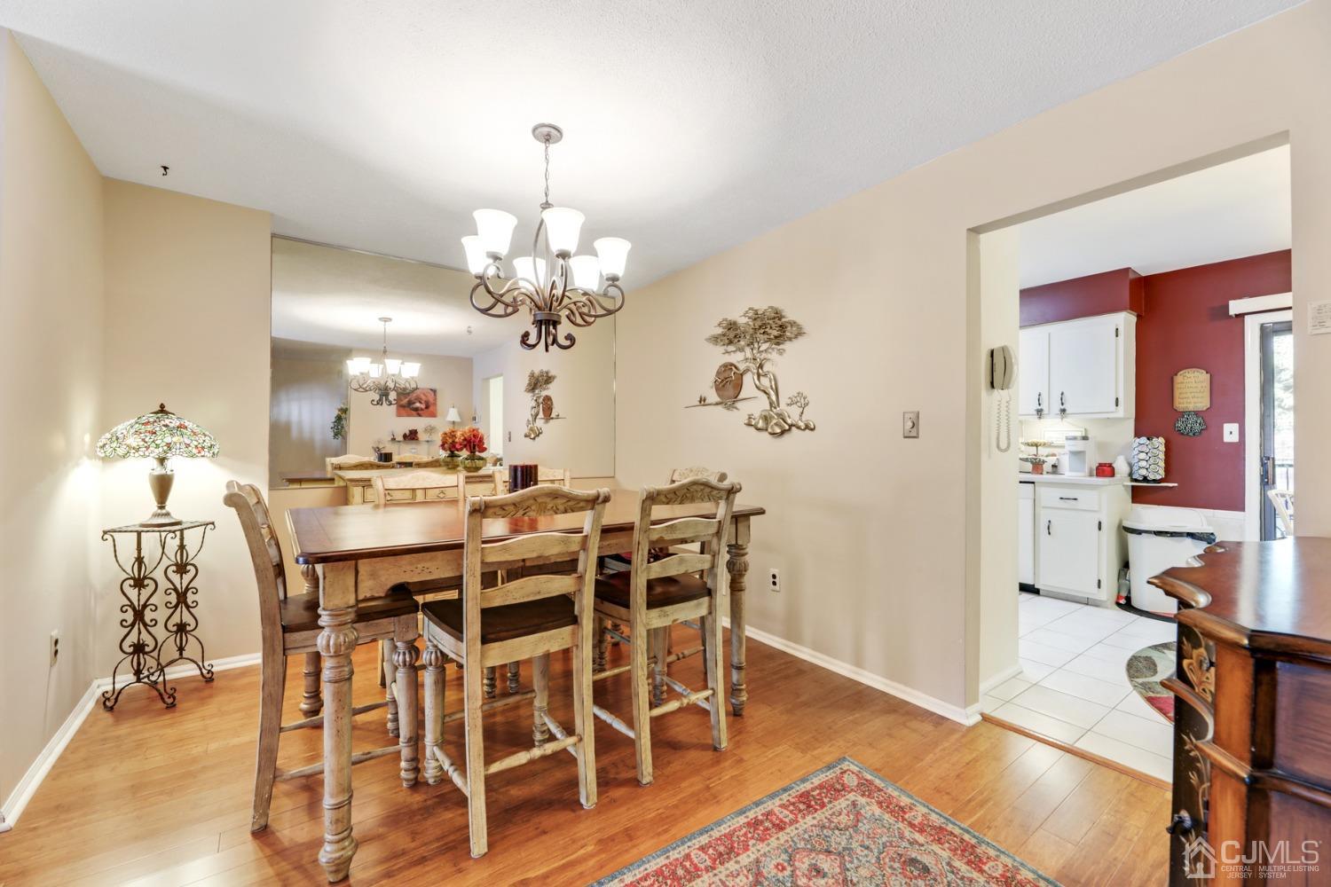 81 Pheasant Run Edison, NJ 08820 - Photo 7 of 24 a view of a dining room with furniture and wooden floor