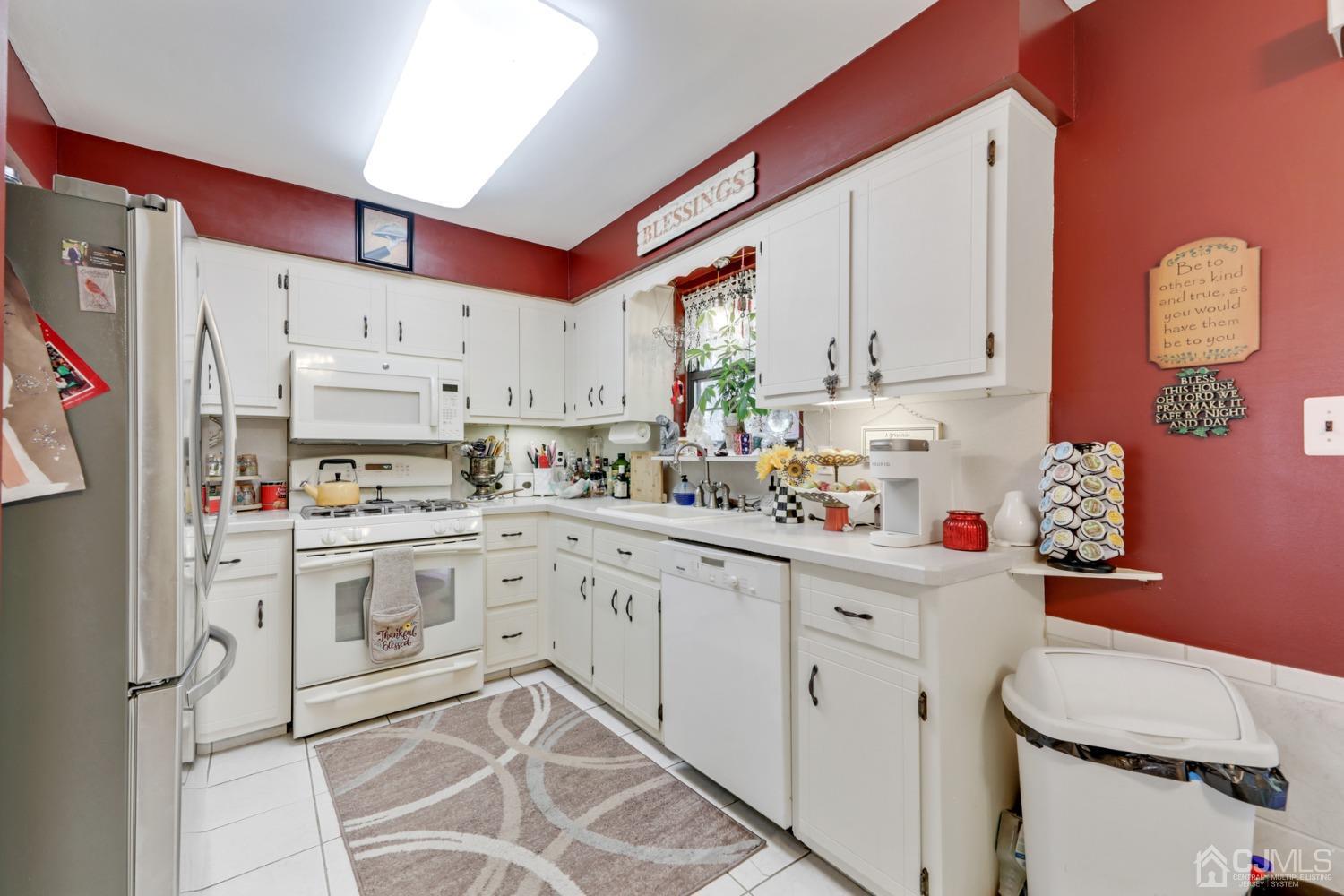 81 Pheasant Run Edison, NJ 08820 - Photo 9 of 24 a kitchen with granite countertop a sink window and white stainless steel appliances