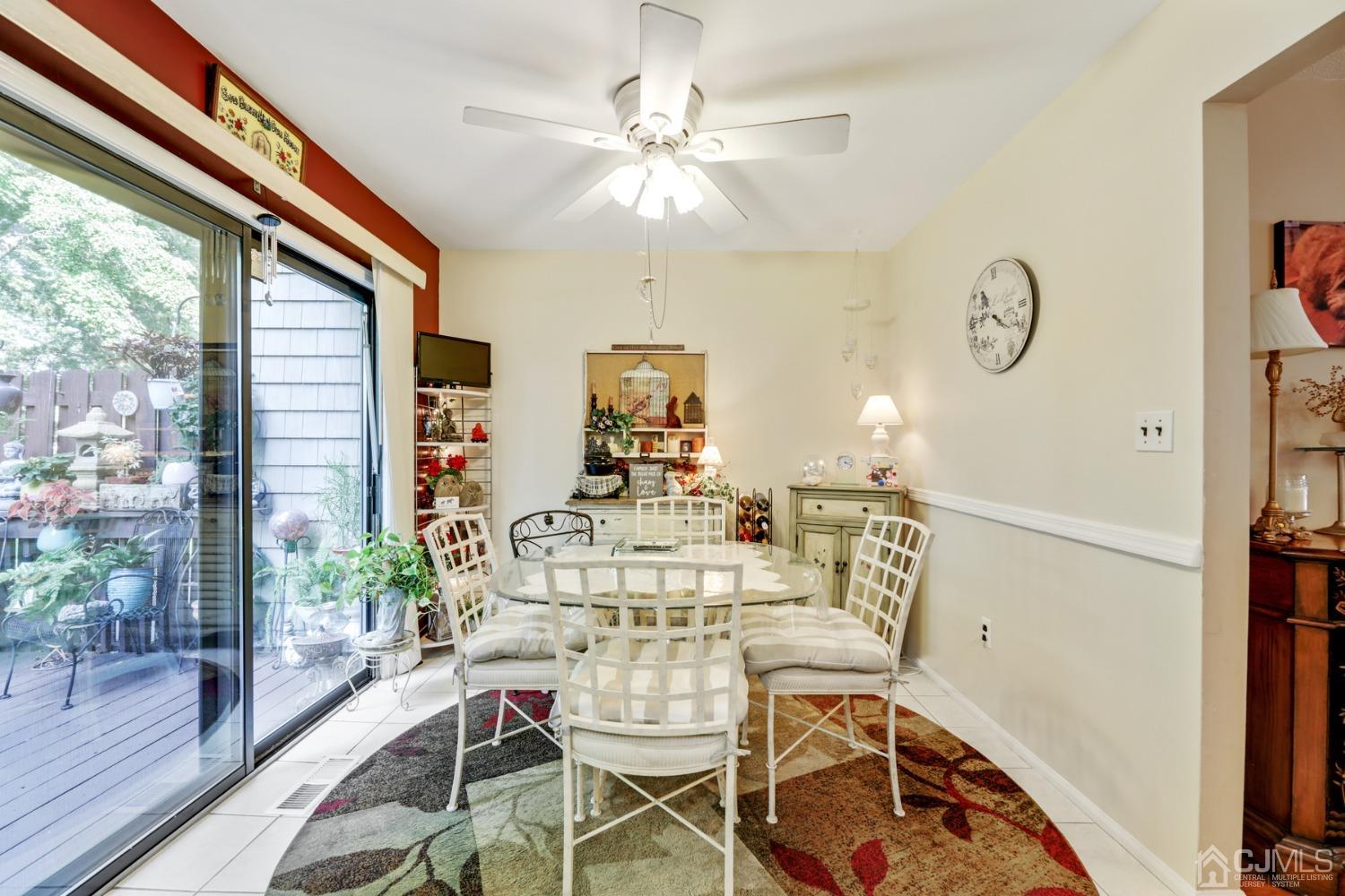 81 Pheasant Run Edison, NJ 08820 - Photo 10 of 24 a view of a dining room with furniture window and wooden floor